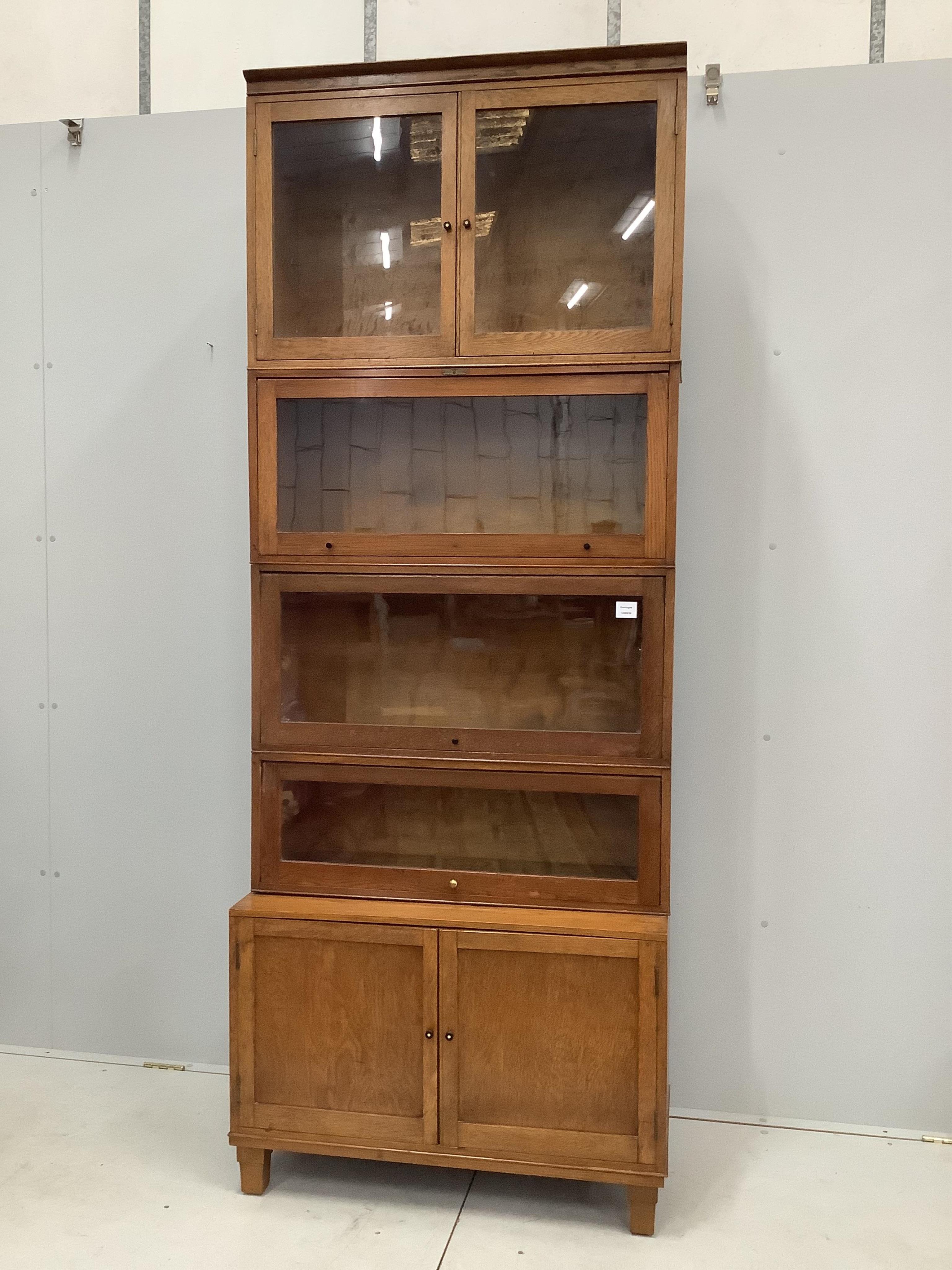 An early 20th century oak 'Business Book Systems' five section bookcase, width 86cm, depth 37cm, height 224cm